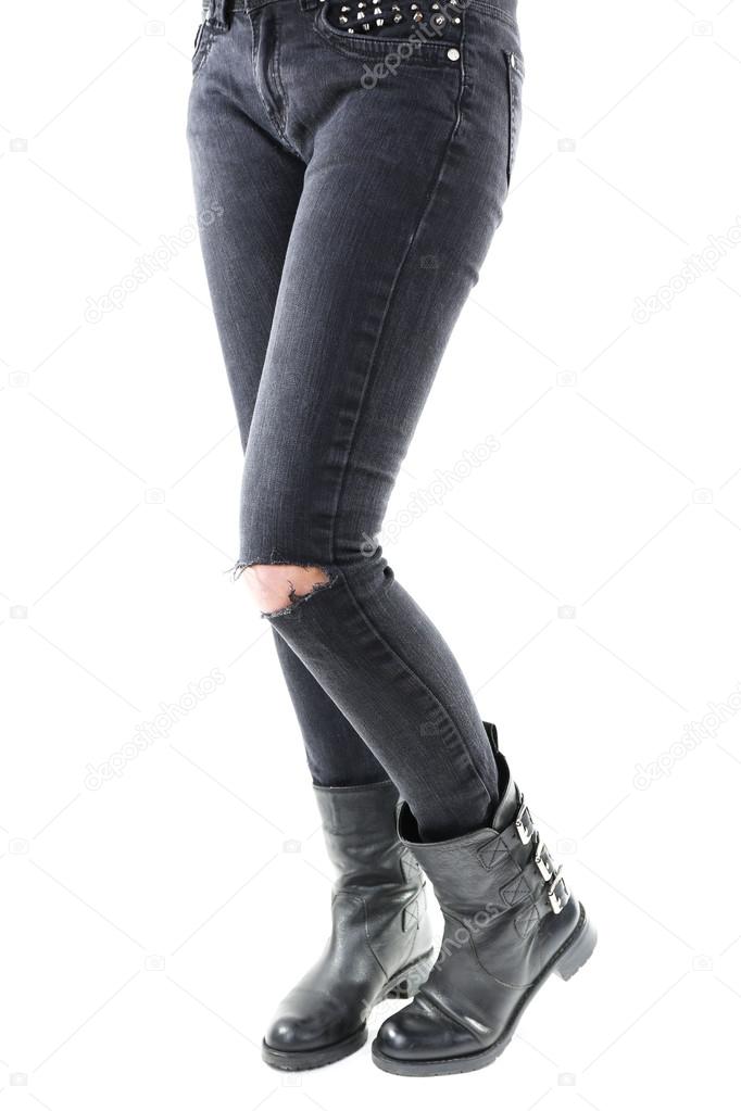 Girlish legs in torn jeans