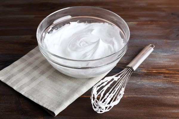 Whipped egg whites for cream on wooden background — Stock Photo, Image