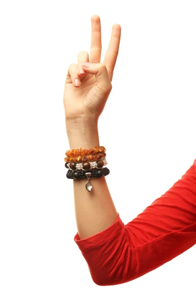 Mano femenina con pulseras aisladas en blanco — Foto de Stock