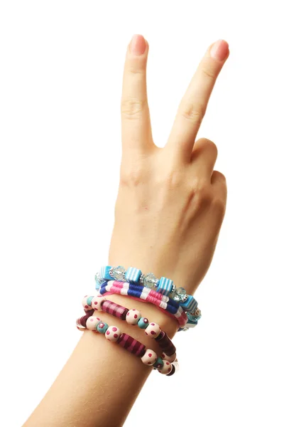 Mano femenina con pulseras aisladas en blanco — Foto de Stock