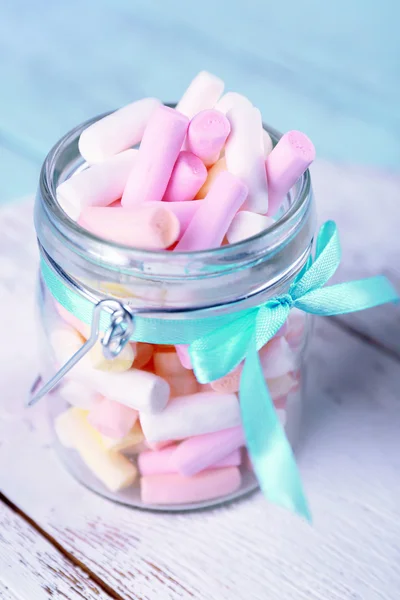 Sweet candies on color wooden table, closeup — Stock Photo, Image