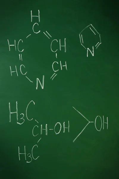 Molecule models and formulas on blackboard background — Stock Photo, Image