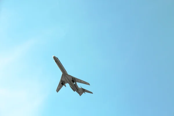 Model of plane over blue sky background