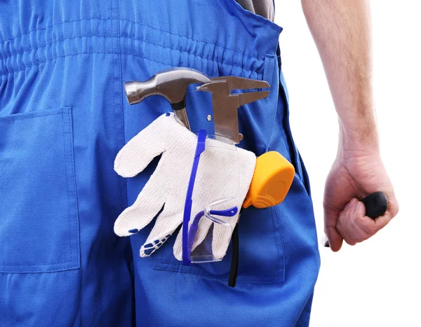 Homem de macacão com ferramentas no bolso isolado em branco — Fotografia de Stock