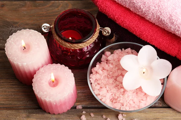Spa still life with candlelight and sea salt on wooden background — Stock Photo, Image