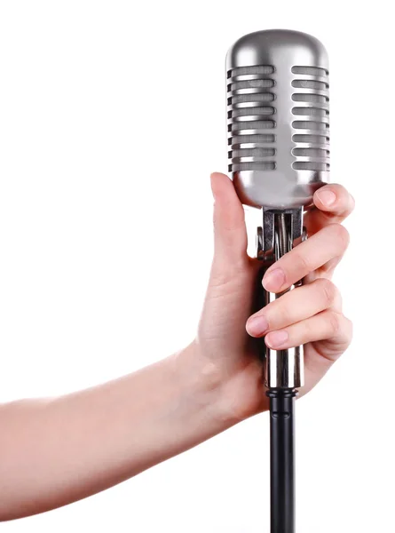 Ρετρό μικρόφωνο στο γυναικείο χέρι που απομονώνονται σε λευκό — Φωτογραφία Αρχείου