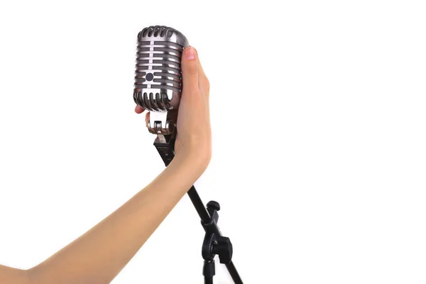 Retro microphone in female hand isolated on white — Stock Photo, Image