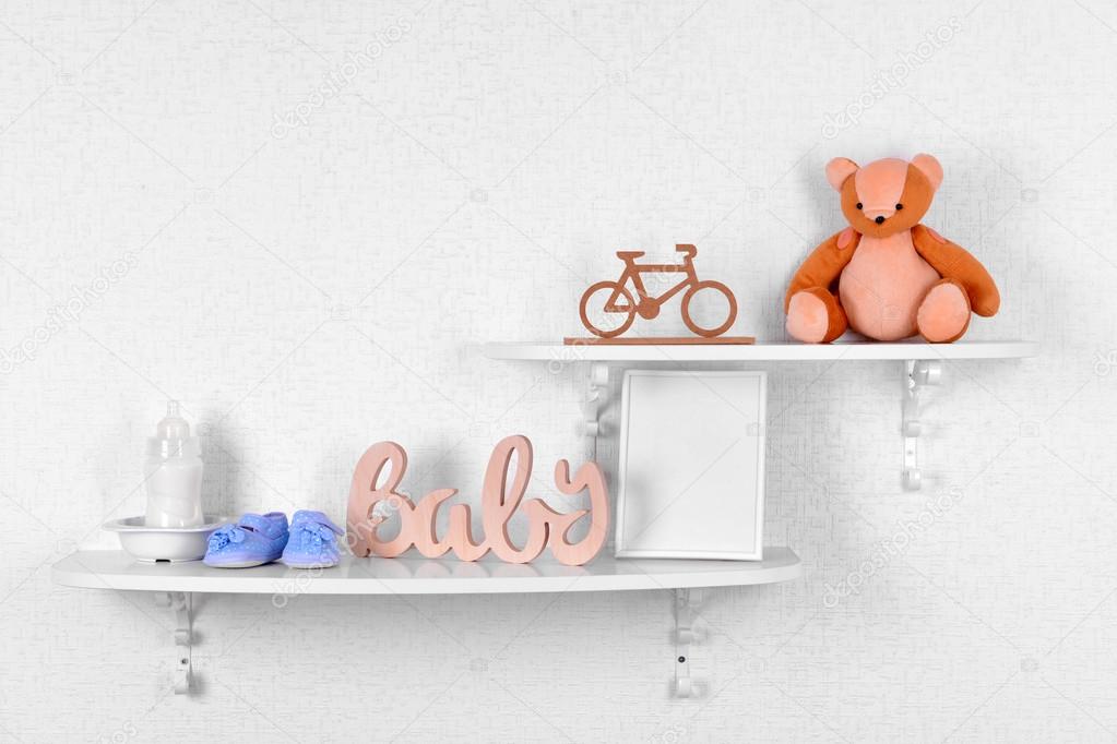 Baby accessories on shelves closeup — Stock Photo © belchonock 71793871