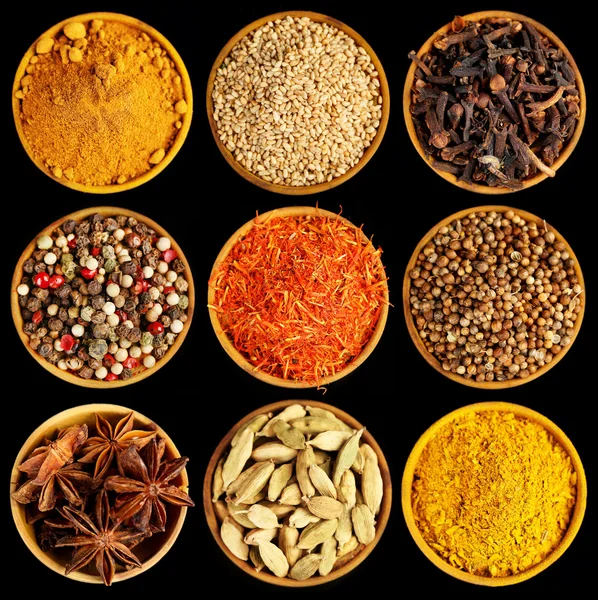 Different spices on black background — Stock Photo, Image