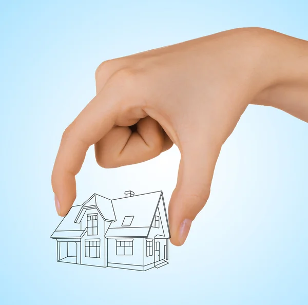 Human hand holding house sketch project — Stock Photo, Image