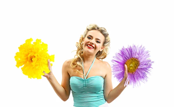 Beautiful girl with pretty smile and flowers in hands isolated on white — Stock Photo, Image