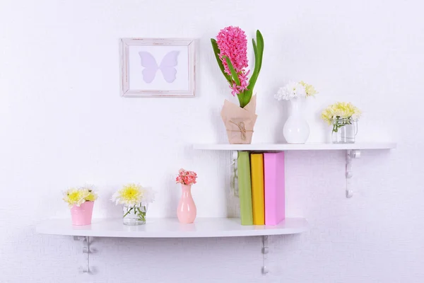 Flower on shelves on white wall background — Stock Photo, Image