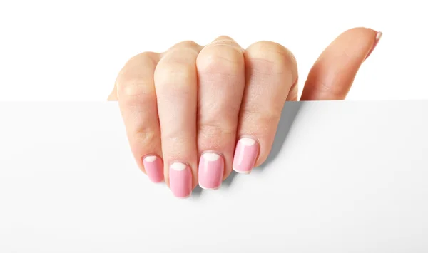 Feminino mão segurando papel em branco isolado no branco — Fotografia de Stock