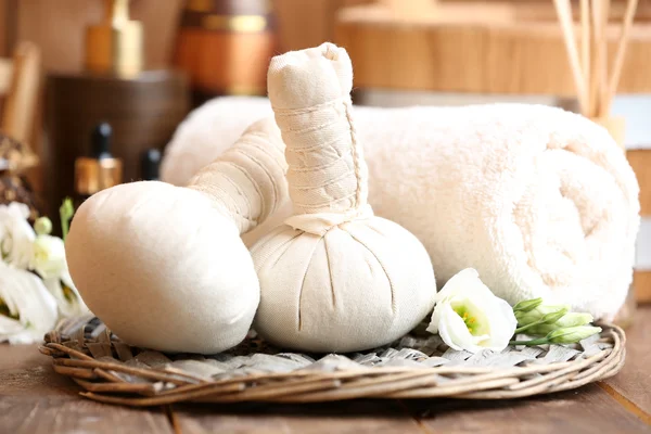 Beautiful spa composition with massage bags on table close up — Stock Photo, Image