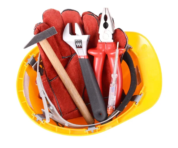 Construction tools i hjälm isolerad på vit — Stockfoto