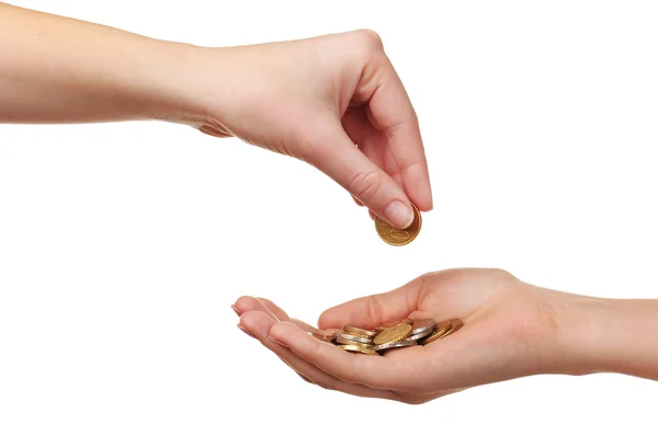 Mano femenina poniendo moneda en otra mano aislada en blanco — Foto de Stock