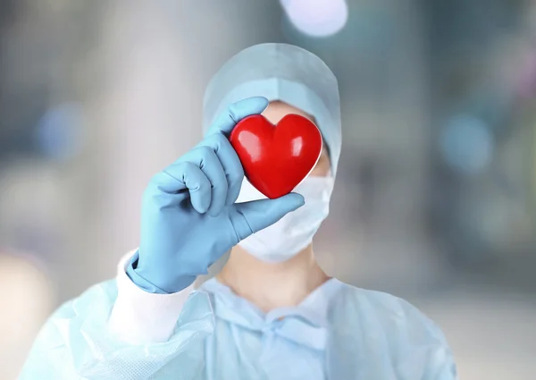 Doctor with heart in hospital — Stock Photo, Image