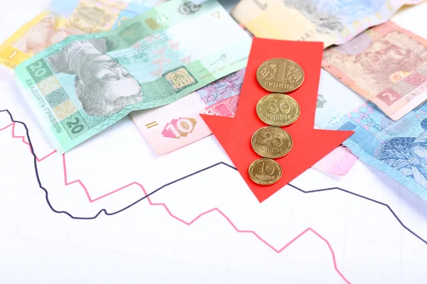 Money and red arrow on graph document close up — Stock Photo, Image
