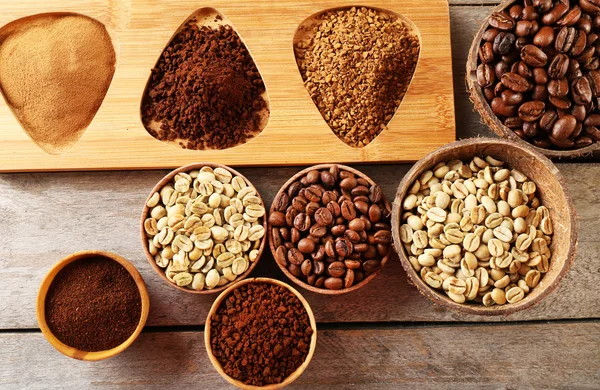 Various of coffee in small dishes on wooden table, top view — Stock Photo, Image