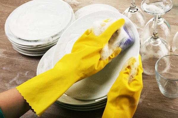 Female hand washing dish close up — Stock Photo, Image