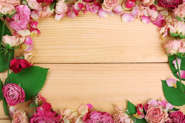 Frame of beautiful dry flowers on wooden background — Stock Photo, Image