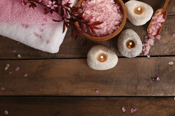 Beautiful spa composition with spring flowers on wooden background