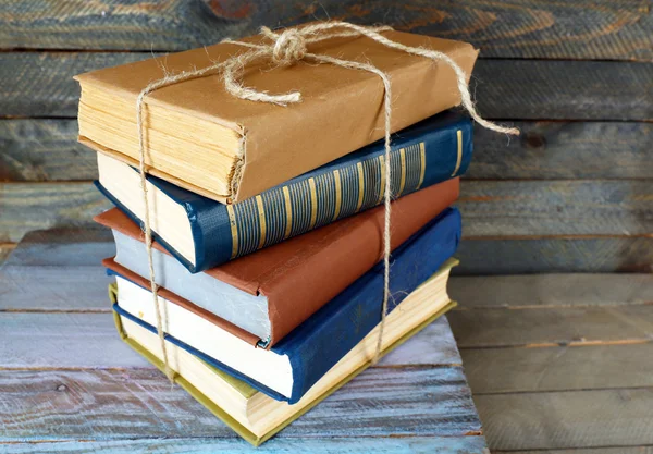 Stack of books on wooden background — Stock Photo, Image