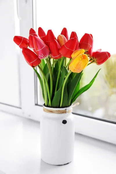 Bouquet of fresh tulips on windowsill background — Stock Photo, Image