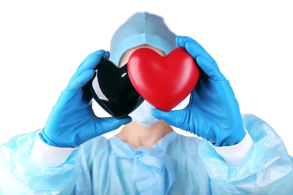 明るい背景上、医師の手で装飾的な心 — ストック写真