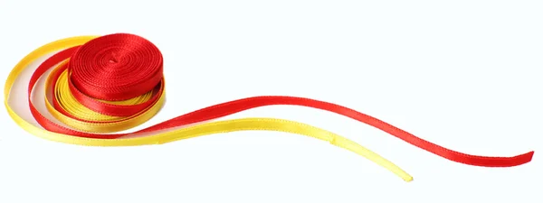 Colorful red and yellow ribbons isolated on white — Stock Photo, Image