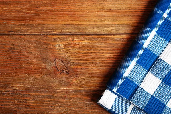 Napkin on wooden background — Stock Photo, Image
