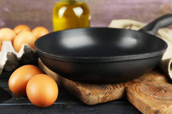 Still life with eggs and pan — Stock Photo, Image
