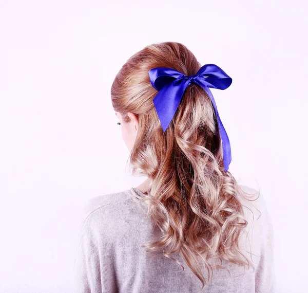 Female hairstyle with color ribbon isolated on white — Stock Photo, Image