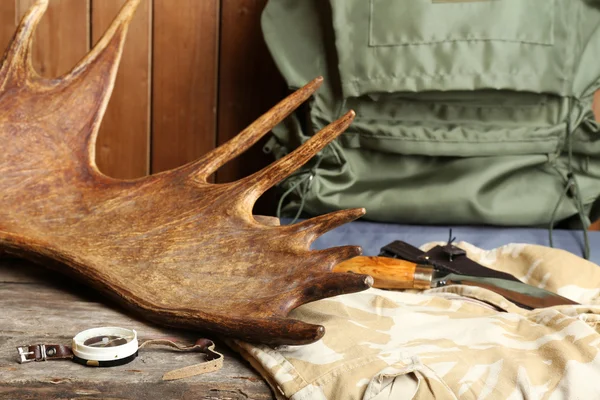 Hunting gear on wooden background — Stock Photo, Image