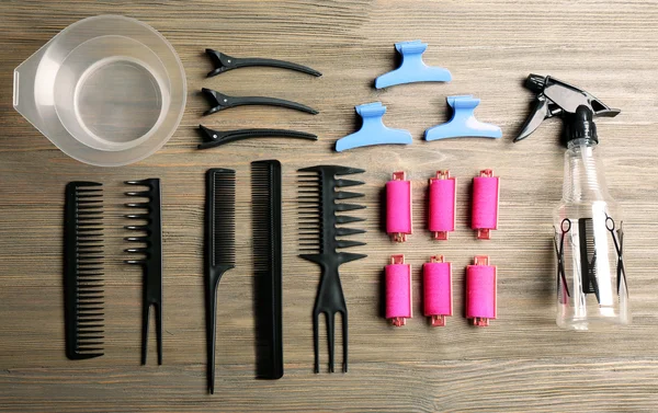 Hairdressing tools on wooden background — Stock Photo, Image