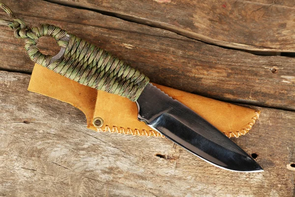 Hunting knife on wooden background — Stock Photo, Image