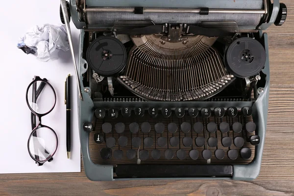 Retro typewriter on wooden table, top view — Stock Photo, Image