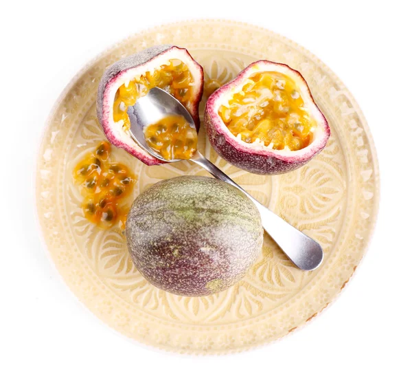 Passion fruit on plate isolated on white — Stock Photo, Image