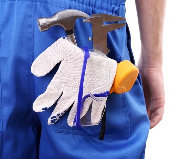 Man in overall met tools — Stockfoto