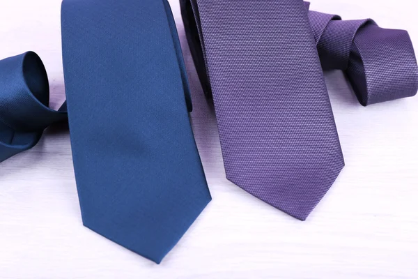 Elegance ties on wooden table, closeup — Stock Photo, Image