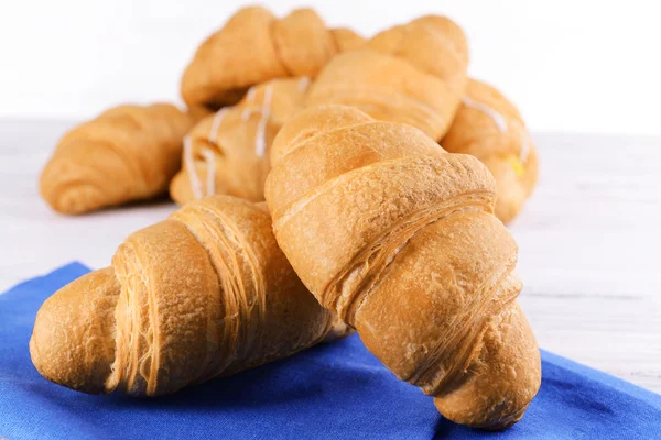 Delicious croissants on table — Stock Photo, Image