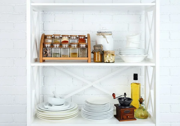 Kitchen shelving with dishes — Stock Photo, Image