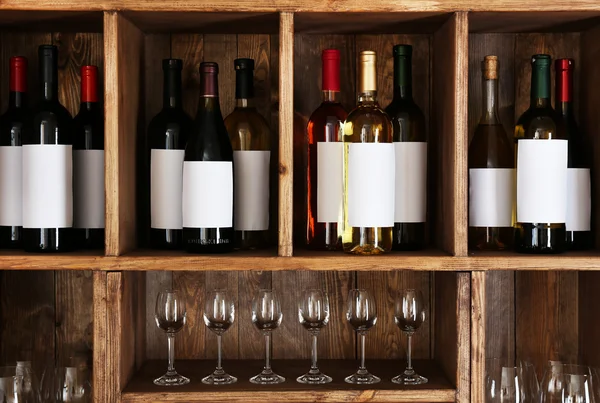 Shelving with wine bottles — Stock Photo, Image