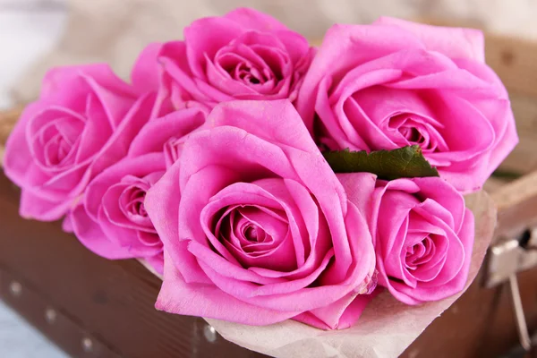 Beautiful pink roses in suitcase — Stock Photo, Image