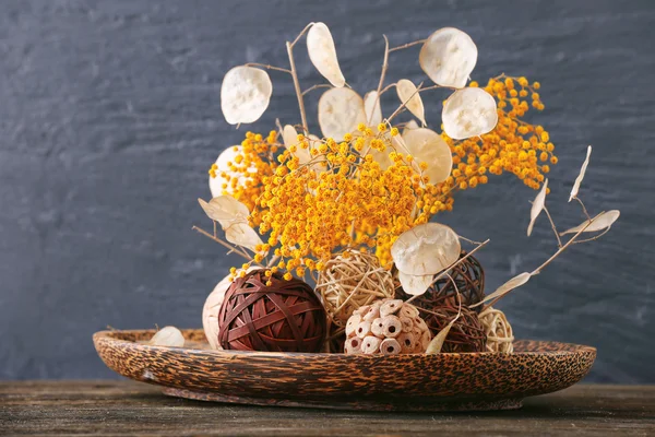 Composition of dried flower on blue wall background — Stock Photo, Image