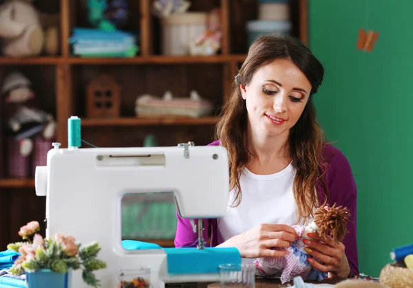 Young needlewoman in workshop — Stock Photo, Image