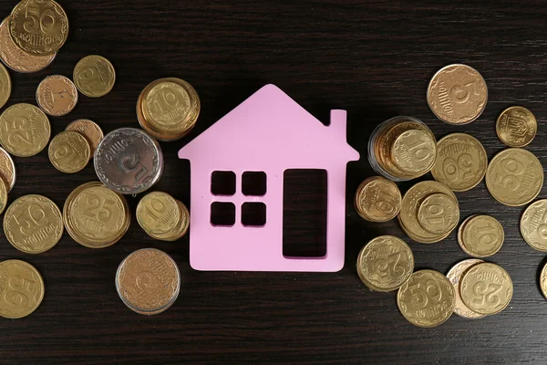 Model of house with coins — Stock Photo, Image