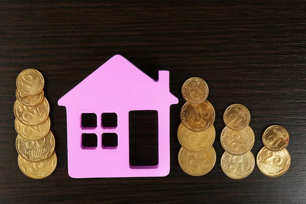 Model of house with coins — Stock Photo, Image