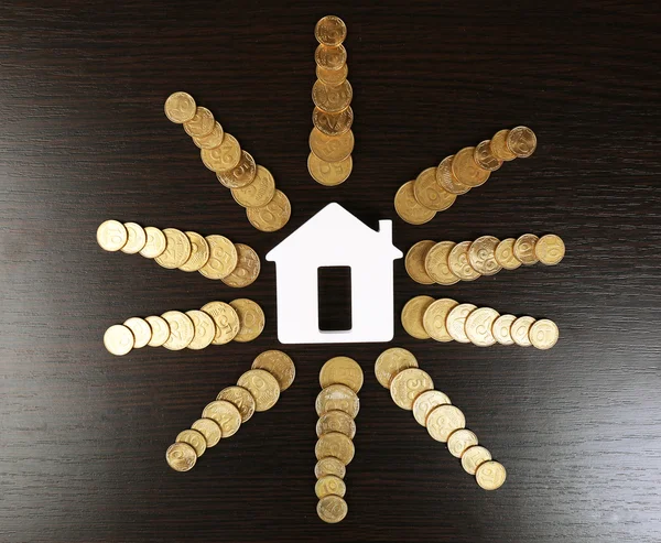 Model of house with coins — Stock Photo, Image