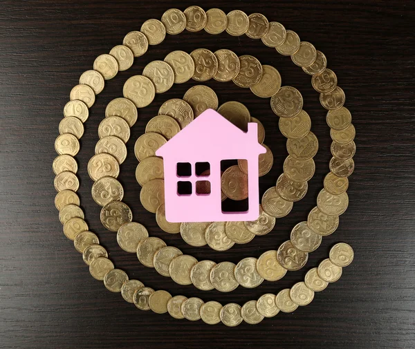 Model of house with coins — Stock Photo, Image